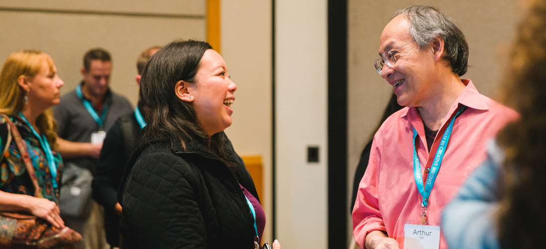A pair of attendees speaking to each other at the 2019 AWP Conference & Bookfair